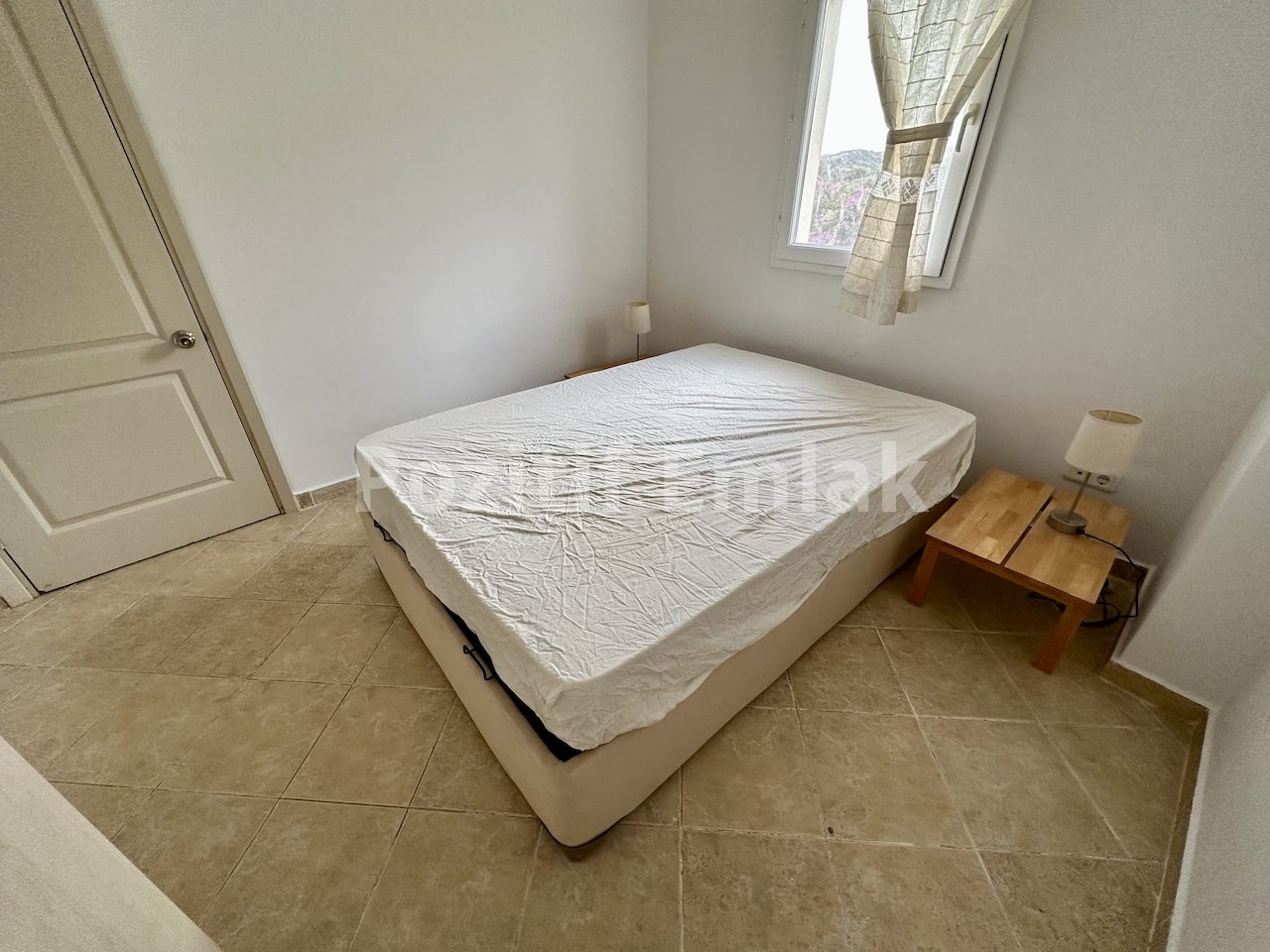 Gümüşlük'te Havuzlu Güvenlikli Sitede Manzaralı Ferah Daire
